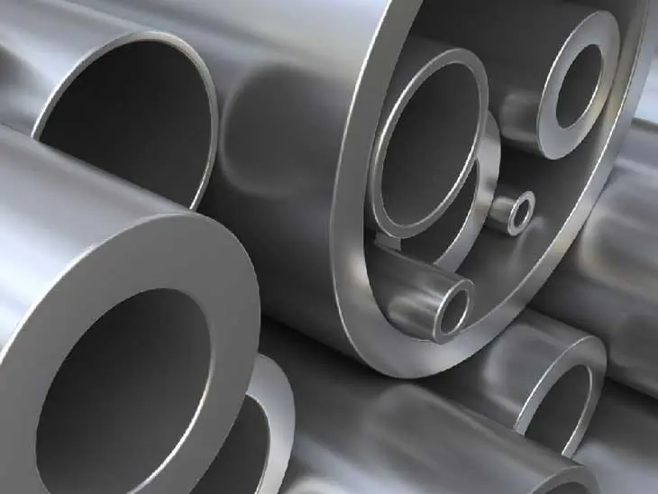 Close-up of stacked metallic pipes with smooth surfaces.