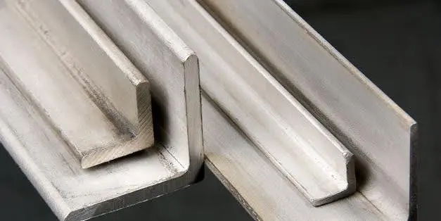 Close-up of metal L-shaped brackets on a metallic surface.