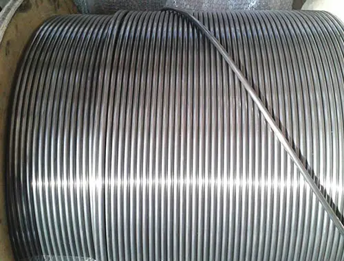 Close-up of tightly coiled metal wire with a smooth, shiny surface.